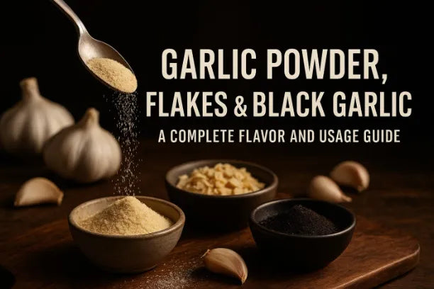 Garlic powder, flakes, and black garlic displayed in bowls on a wooden board with whole garlic cloves, illustrating a complete flavor and usage guide.